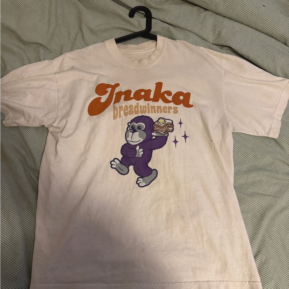 NAK Cream and Orange Graphic Tee